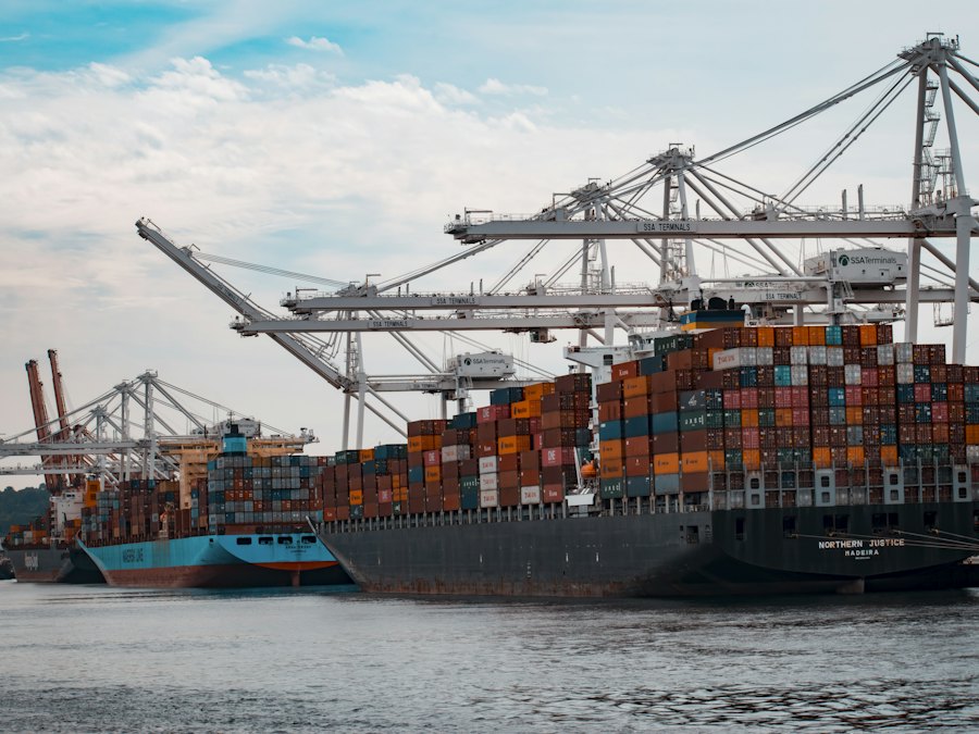 Container ship at a port with cargo cranes