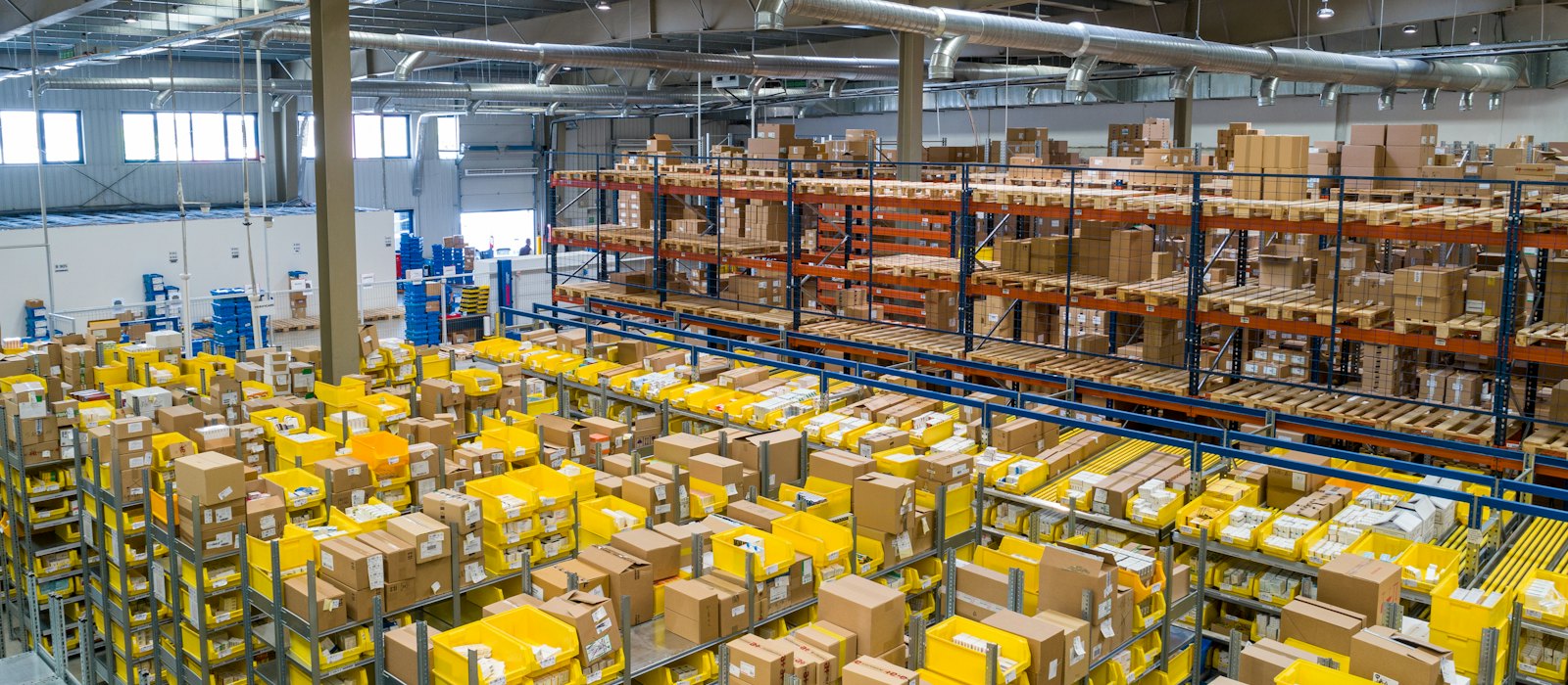 Warehouse aisles with shelving and packaged goods